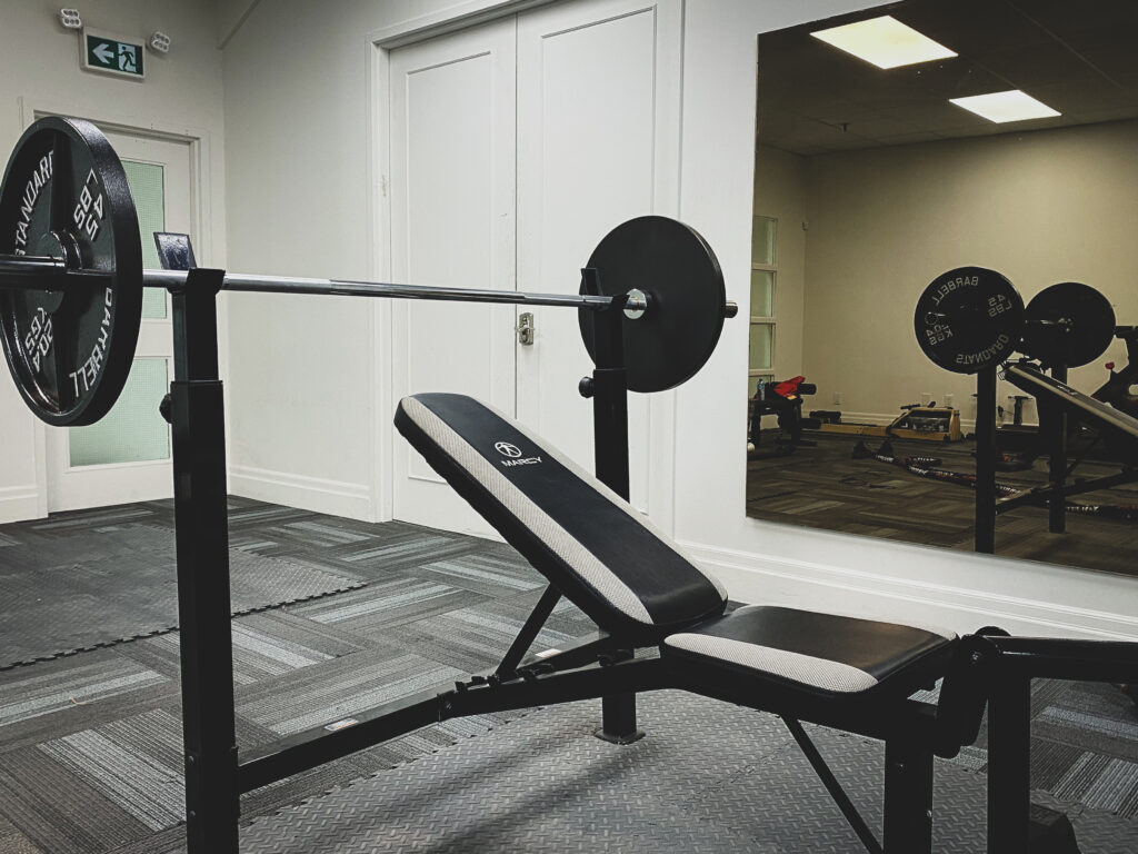 Close-up shot of a barbell in Oakbay Think Tank's gym